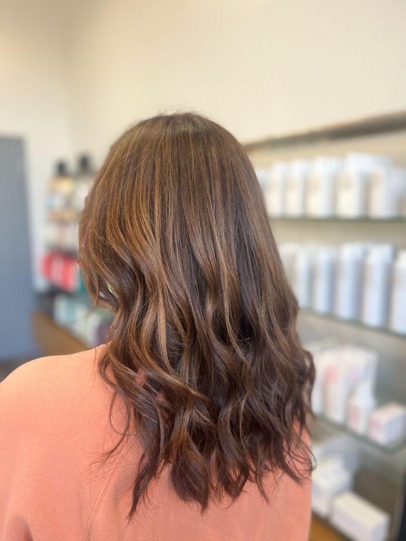 Dimensional brunette balayage with loose waves at Essentials Salon, Warrington PA