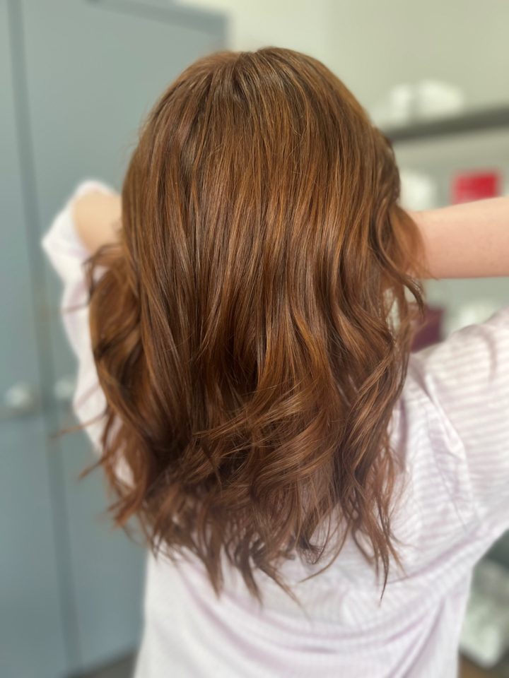 Copper brown hair color with soft waves at Essentials Salon, Warrington PA